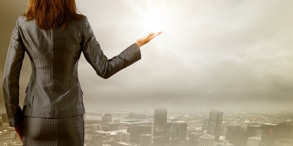 Back view of businesswoman against big city scene