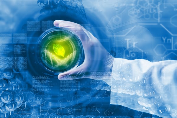 Close up image of human hand holding test tube. Science concept