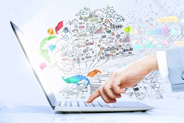 Close up image of laptop and human hands typing on keyboard