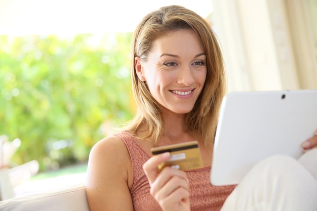 Portrait of woman shopping on internet with tablet.jpeg